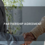 2 persons handshaking on partnership agreement