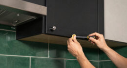 Black, Bold Cabinets And Dramatic Green Tiles Refresh This 2000S Kitchen