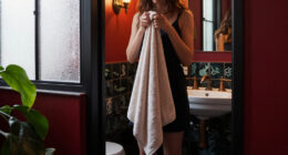 A Tiny Bathroom Went From Grimy To Cozy After A "Gothic-Aquatic" Redo